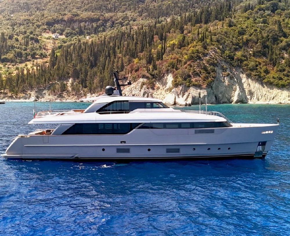 At anchor near a wooded coast