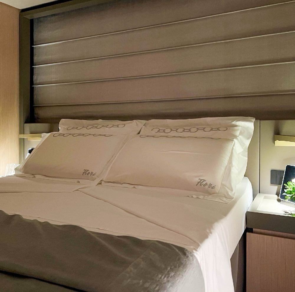 Guest cabin with nightstand and flowers