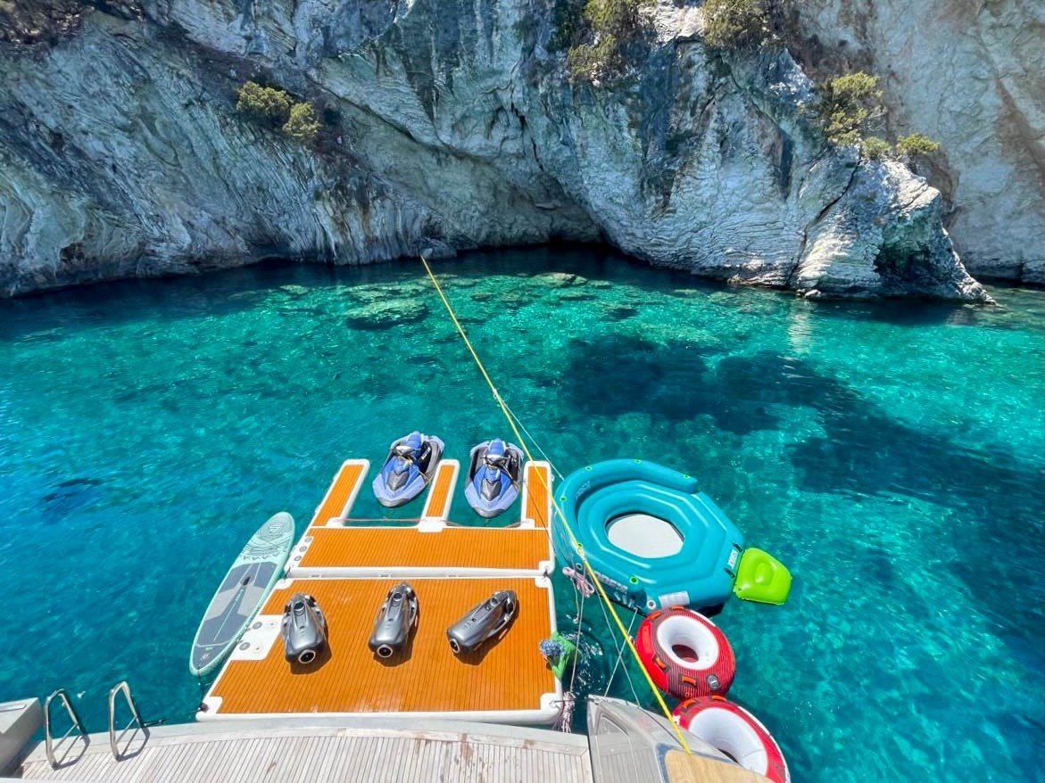 Water toys and sea platform in a cove