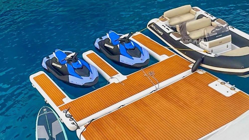 Jet skis and tender at the sea dock
